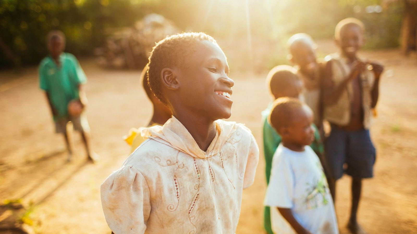 Children playing in warm evening light