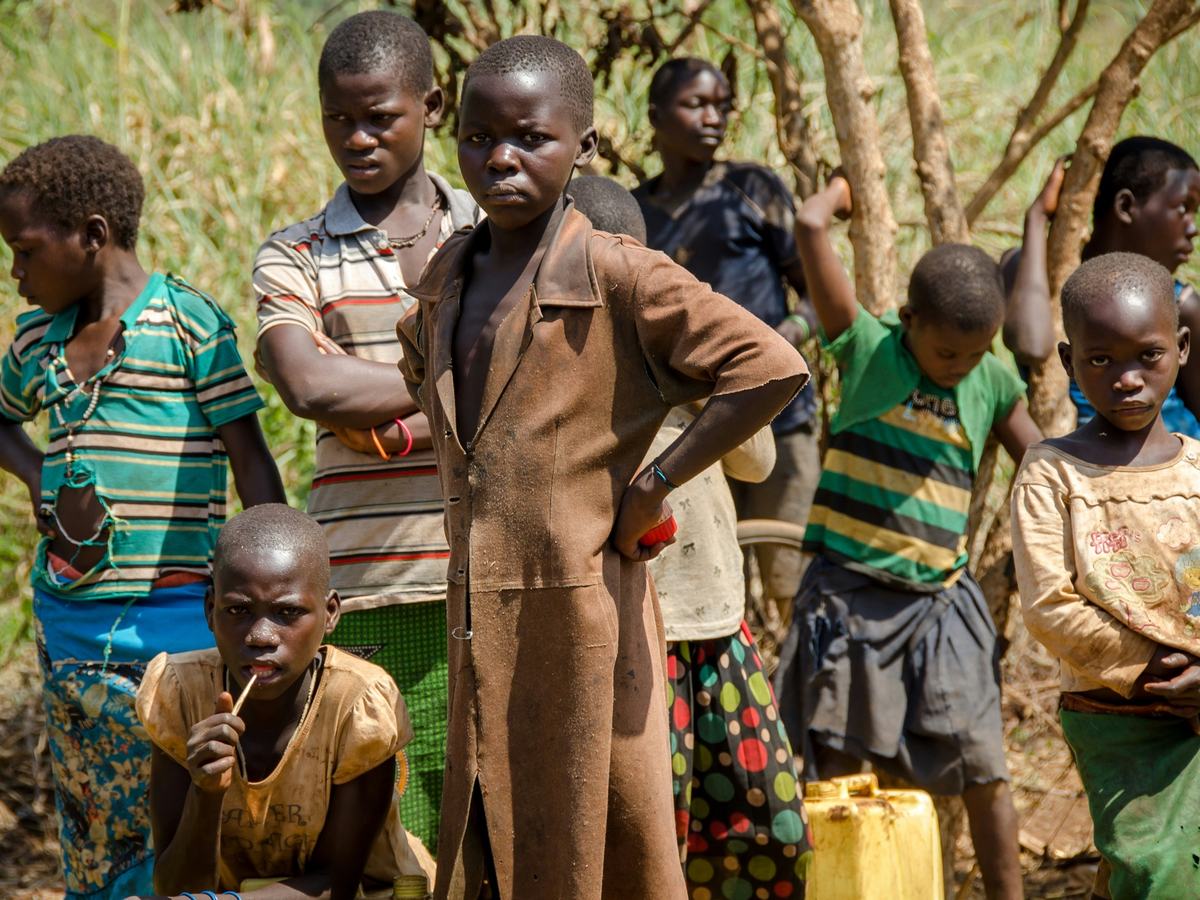 Children standing together outdoors in a Ugandan village